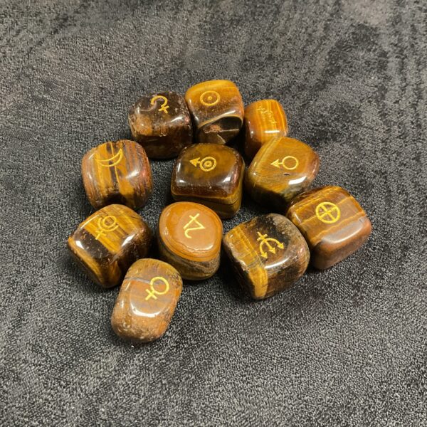 Polished tiger’s eye rune stones for divination and spiritual practice.
