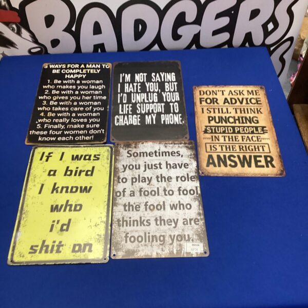 Lot of five humorous tin novelty signs for wall decor.