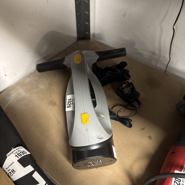 Used Titan window vacuum cleaner with charger for glass cleaning.