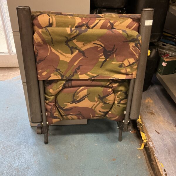 Patterned fishing seat with folding frame for outdoor angling.