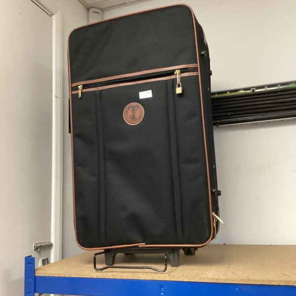 Front view of a vintage Travelon wheeled suitcase.