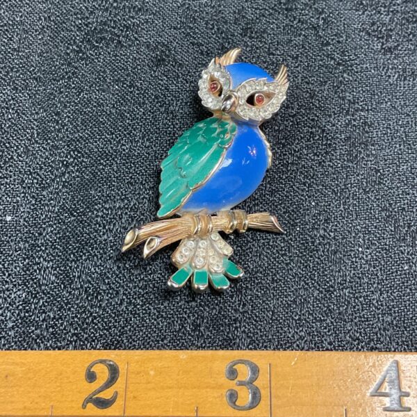 Vintage Triffari enamel owl brooch with blue and green plumage.