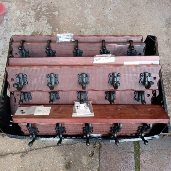 Lot of five vintage Tudor style coat racks for hallway decor.