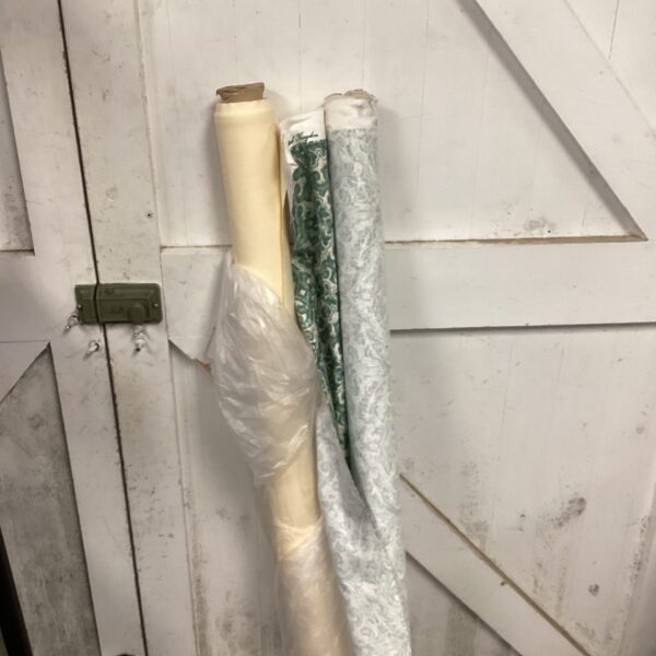 Vintage upholstery fabric rolls, patterned textile lot for home decor.