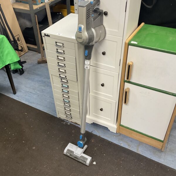 Front view of a Vax cordless hoover in used condition.