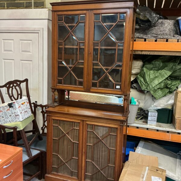 Large Victorian mahogany display cabinet with glass doors.