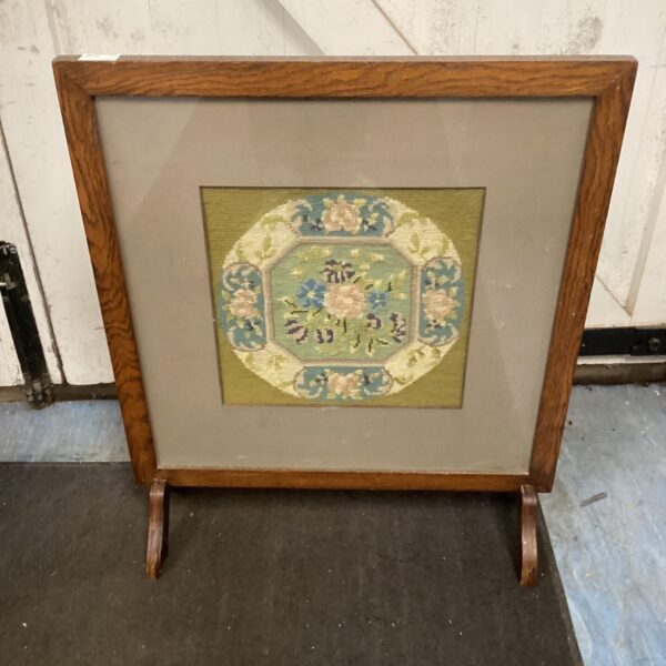 Antique Victorian tapestry fire guard with floral embroidery and oak frame.