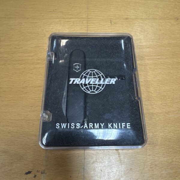 Red handled Victorinox Traveller Swiss Army Knife in original packaging.