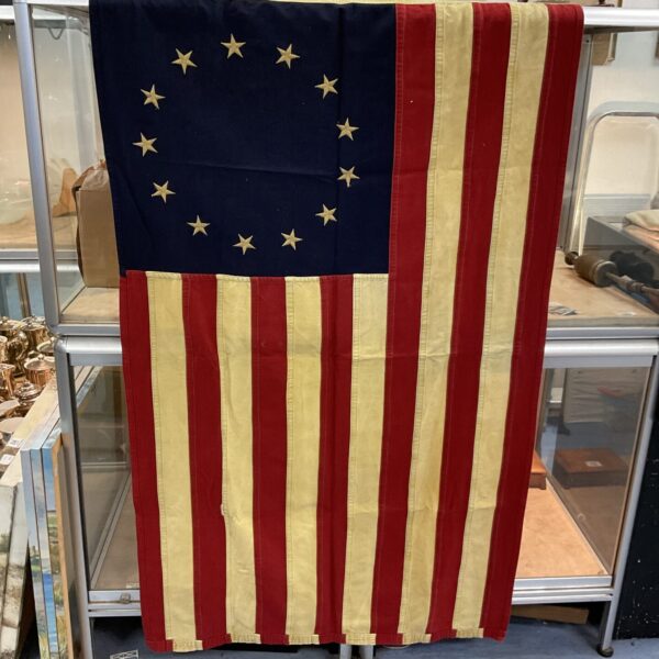 Vintage American flag with 13 stars, representing early American history.