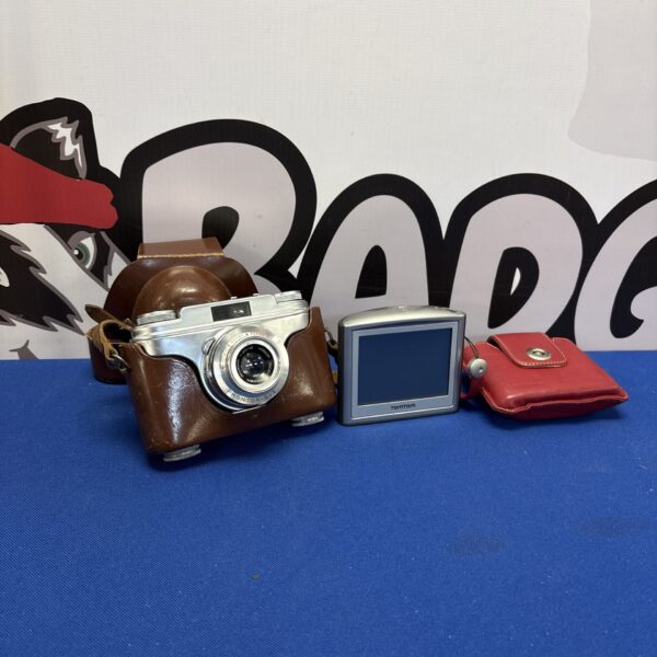 Vintage Anette IA camera with TomTom GPS device.