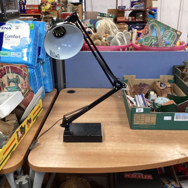 Black vintage Anglepoise desk lamp with adjustable shade.