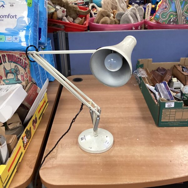 Vintage Anglepoise desk lamp on a table.