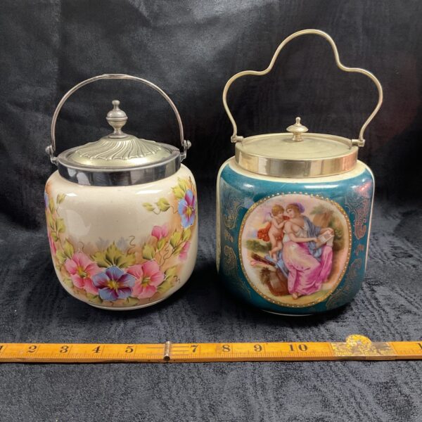 Vintage 1930s biscuit jar with floral design and silver lid.