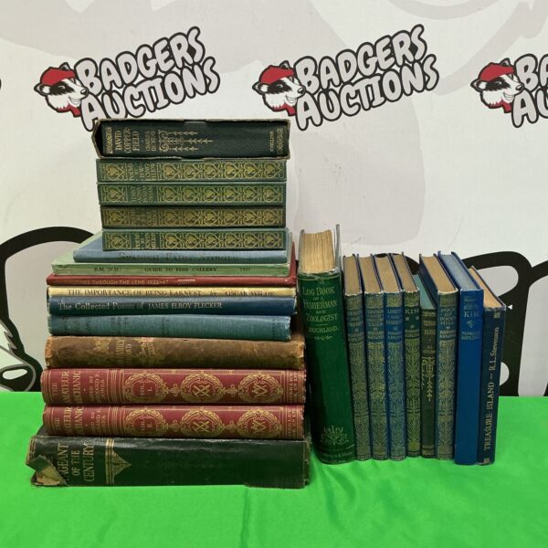Vintage book collection featuring Rudyard Kipling and Charles Dickens.