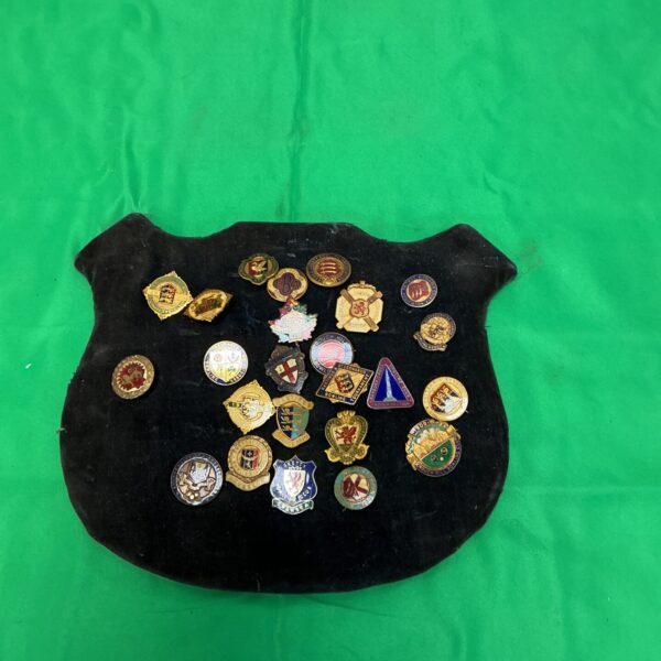 Vintage collection of enamel bowling badges and club crests.