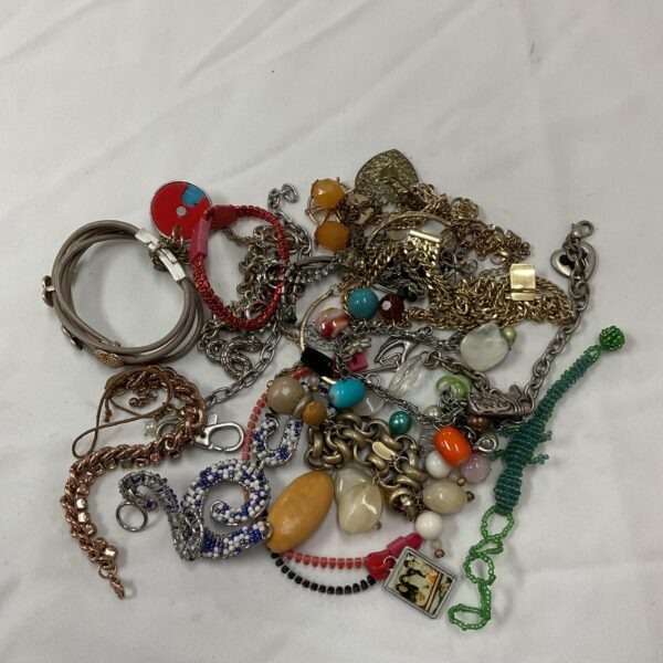 Overview of a vintage bracelet lot with diverse styles and materials.