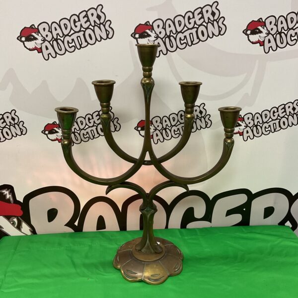Ornate vintage brass candelabra with multiple arms for candles.