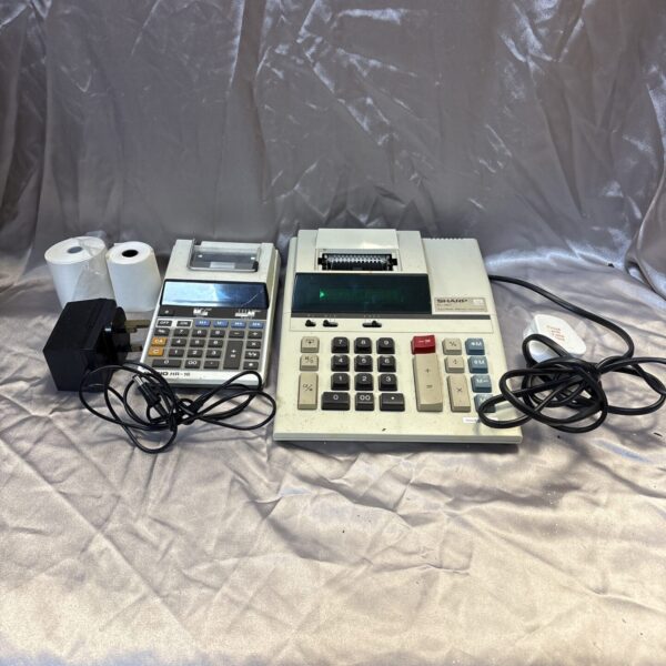 Vintage electronic calculator lot featuring Casio and Sharp models.