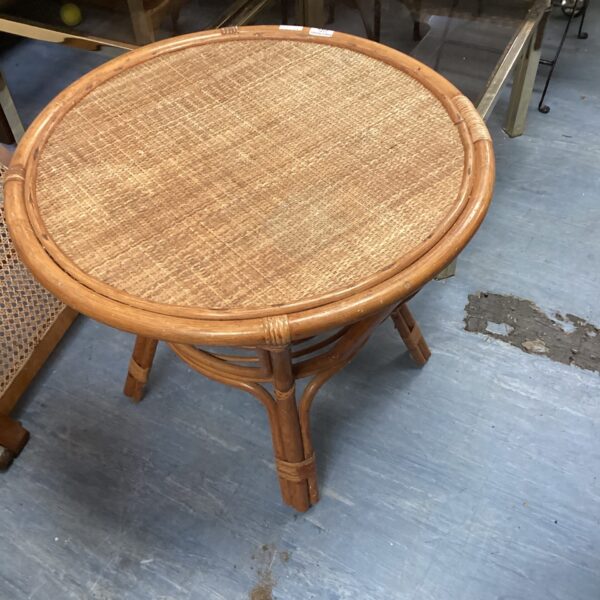 Vintage cane and rattan table with woven top.