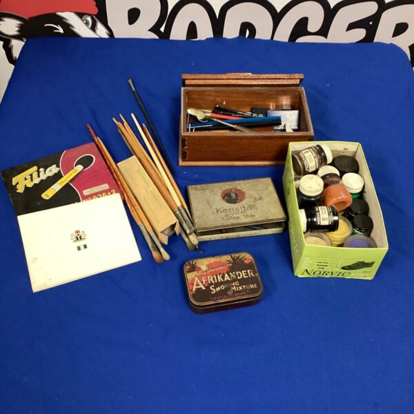 Vintage car supplies lot with paintbrushes and paints in a wooden box.