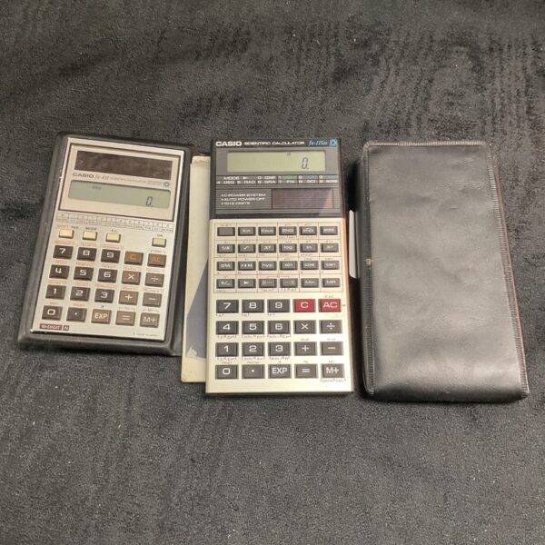 Vintage Casio FX-451 and FX-115N scientific calculators, retro technology.