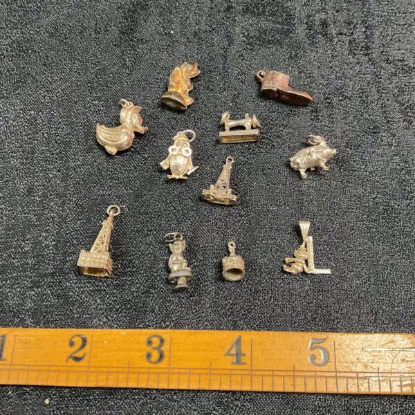 Vintage charm bracelet charms lot with miniature designs.
