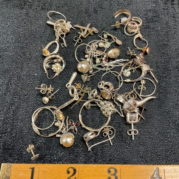 Vintage charm and earring lot with silver and colourful pieces.