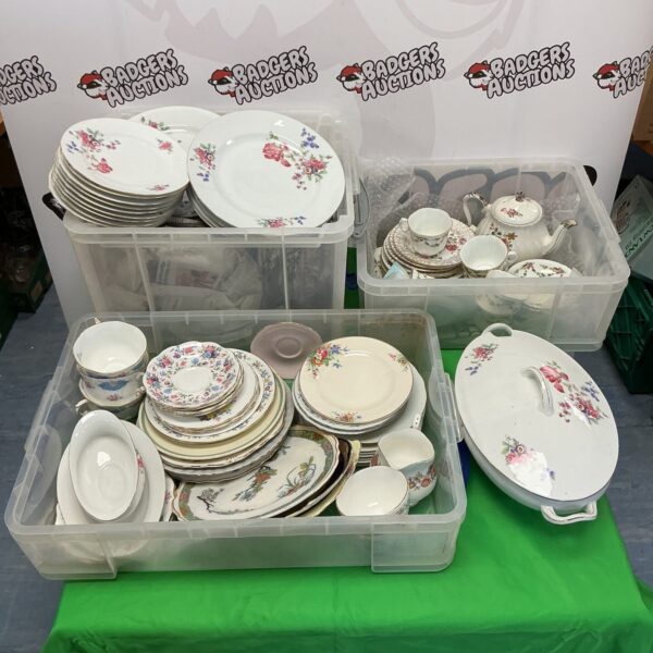 Vintage china tea set lot with floral patterns and Copeland pieces.