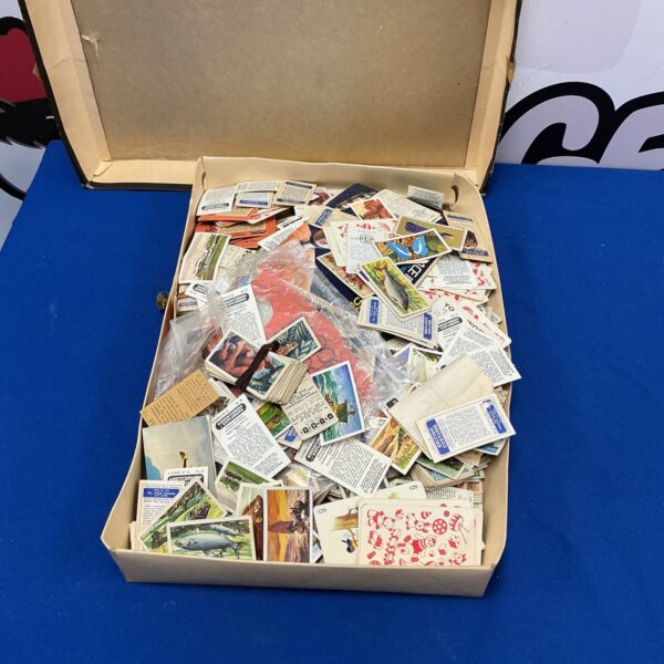 Large collection of vintage cigarette cards for collectors.