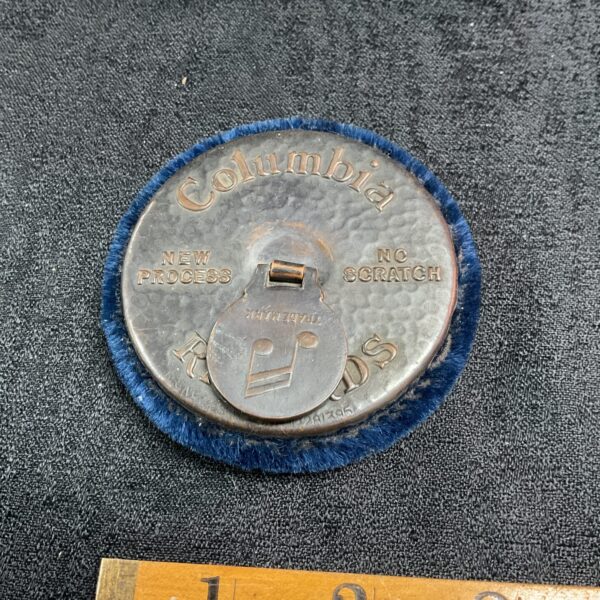 Vintage Columbia record cleaner with felt pad and branding.
