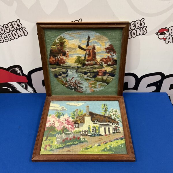 Vintage embroidered cottage scene in oak frame, charming wall art.