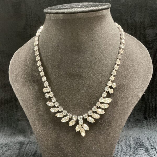 Sparkling vintage crystal necklace with a graduated fan design.