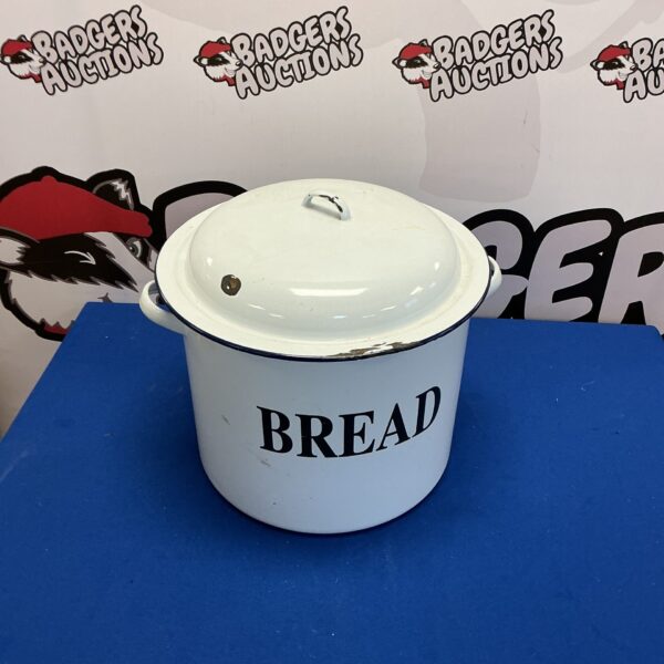 Vintage cream enamelled bread bin for kitchen storage.