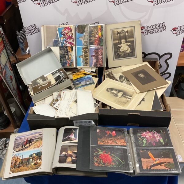 Vintage ephemera collection featuring antique postcards and old photographs.