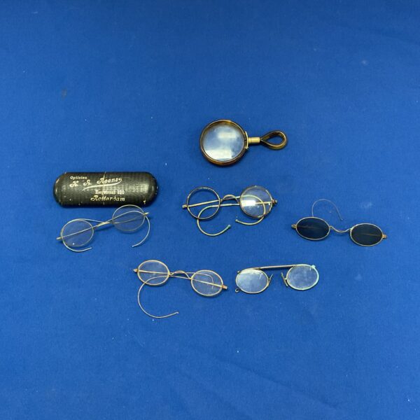Vintage eyeglasses lot featuring five pairs of antique spectacles.