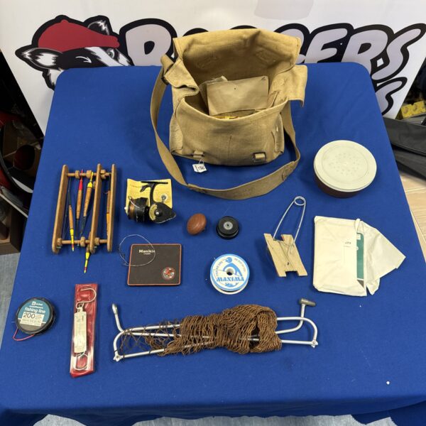 Vintage fishing tackle bag with Intrepid Deluxe reel and lures.