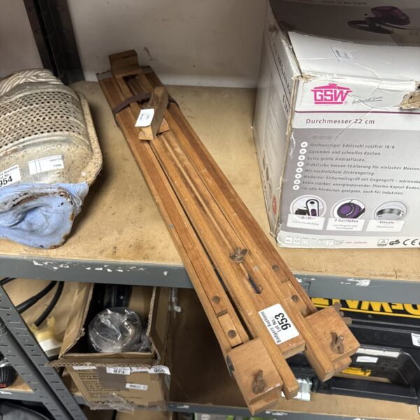 Vintage wooden folding artist easel, showing signs of age.