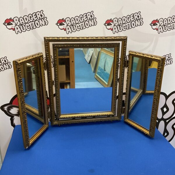 Vintage gilt trifold dressing table mirror with hinged sections.