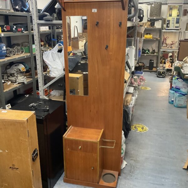 Vintage hallway coat stand with mirror and umbrella holder.