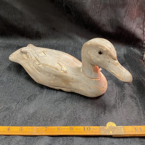 Vintage hand carved wooden duck with folk art paint.