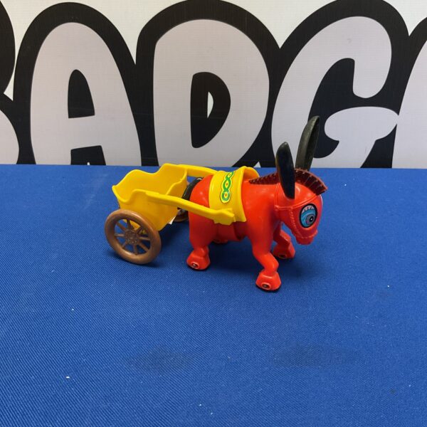 Vintage Hong Kong clockwork donkey toy with cart.
