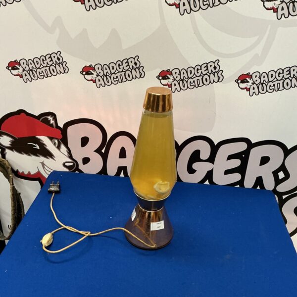 Vintage lava lamp with translucent liquid and wax.