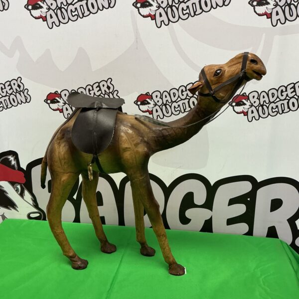 Detailed vintage leather camel sculpture for rustic home decor.