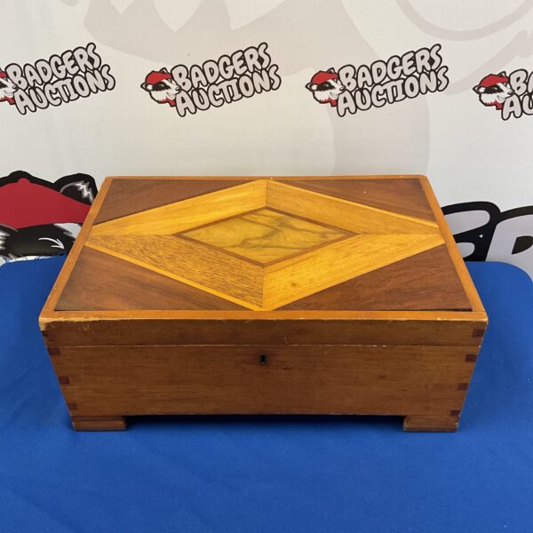 Vintage marquetry box with intricate inlaid wood design.