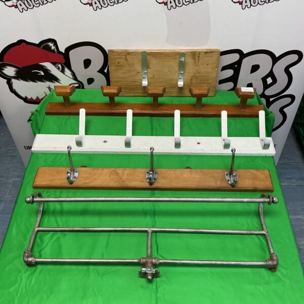 Lot of five vintage metal coat and hat racks for wall mounting.