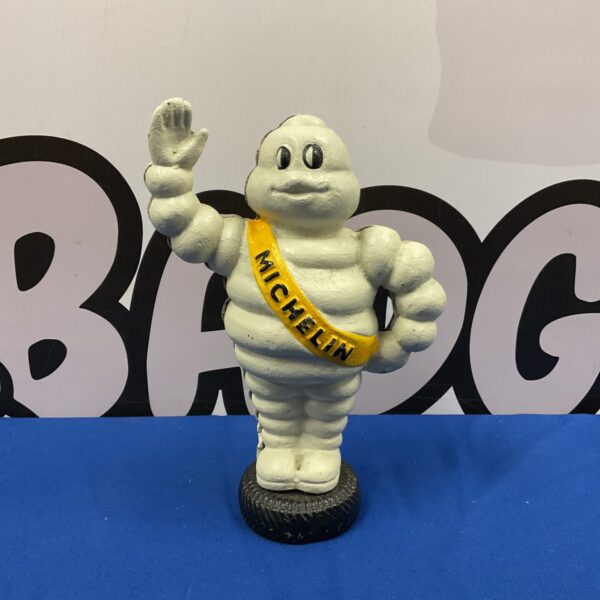 Vintage cast iron Michelin Man money box, classic advertising collectible.