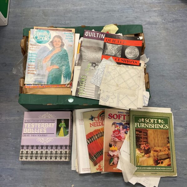 Vintage needlework books and patterns lot for crafting inspiration.