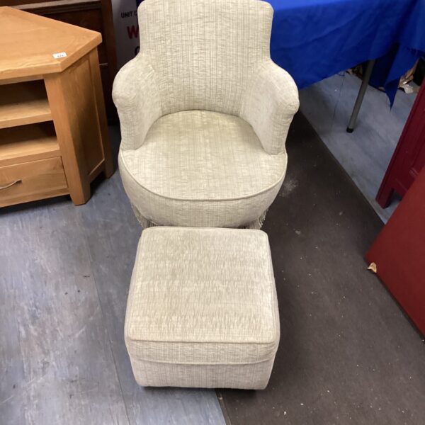 Vintage nursing chair with footstool, retro upholstered armchair.