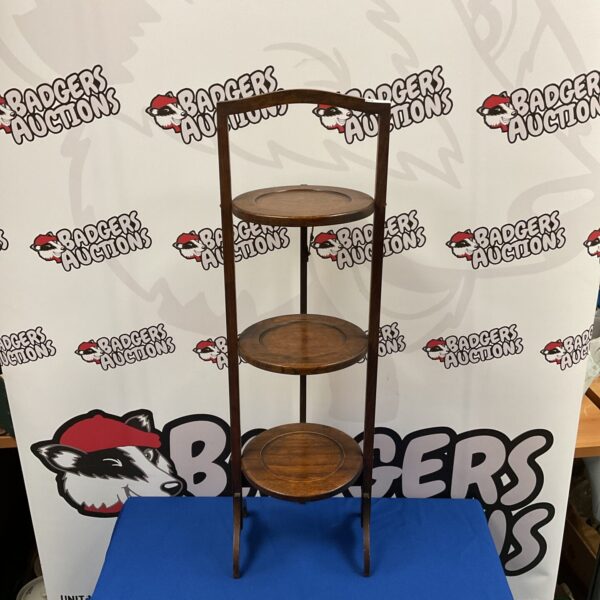 Vintage oak three-tier folding cake stand for serving.