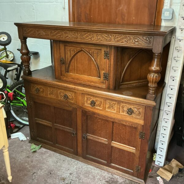Intricately carved vintage oak Jacobean court cabinet.